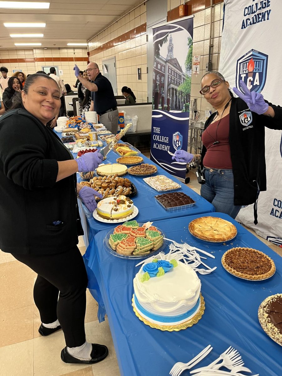 TCA staff Ms. Pereira and Ms. Santana preparing to serve the students.