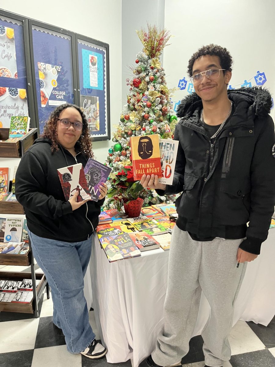 TCA seniors Emely Marte and Hendry Peralta showing off their next reads.  