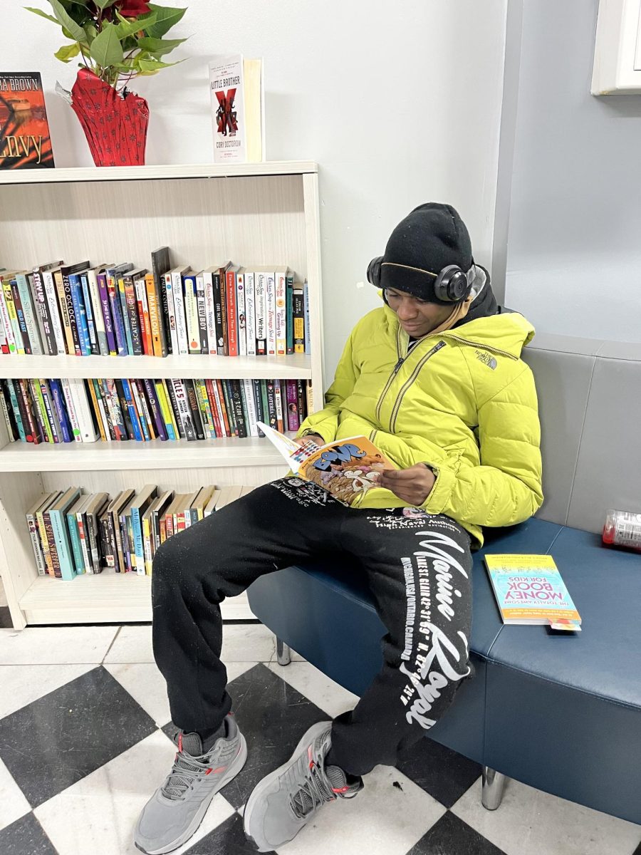 TCA senior Majestic Brown reading his selection.  