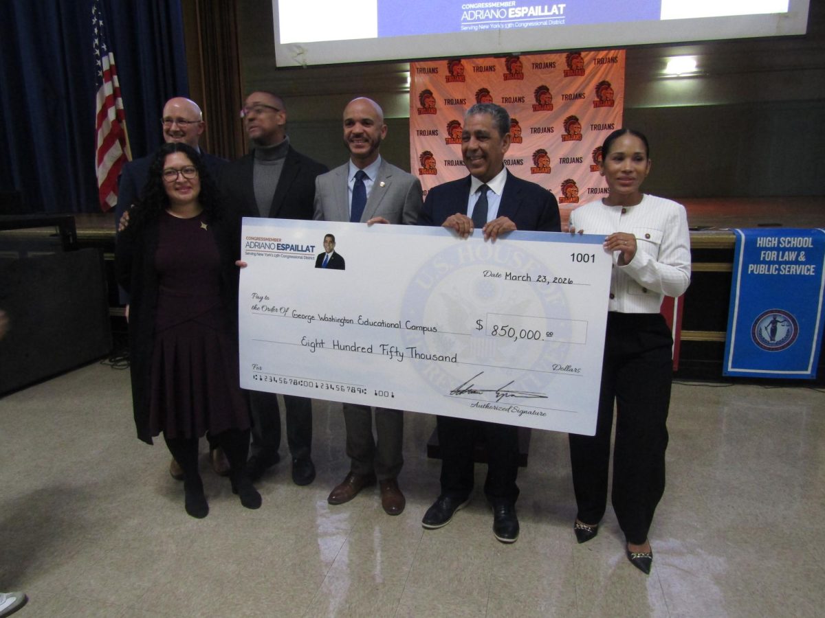 George Washington Educational Campus principals stood with State representative Manny De Los Santos and US Congressman Adriano Espaillat.